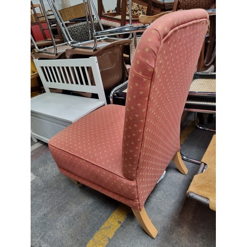 852 - A charming nursing chair with wide comfortable seat upholstered in a terracotta star pattern fabric.... 