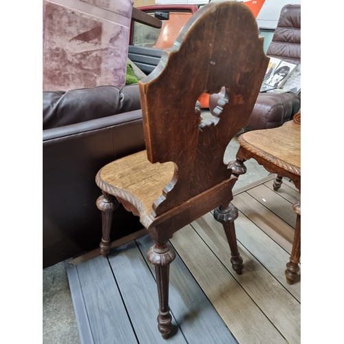 886 - Star lot : A very elegant pair of antique Victorian hall chairs with beautifully carved foliate and ... 