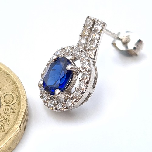 10 - Star Lot : A stunning pair of 9 carat White gold Blue Sapphire stud earrings, featuring beautiful de... 