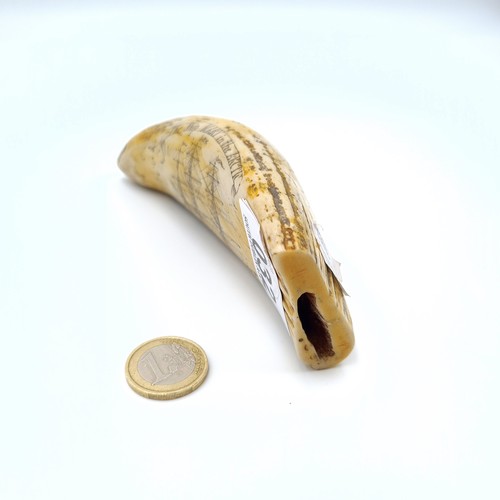 32 - A fine example of an antique repro scrimshaw Whale tooth, with hand carved depictions entitled 