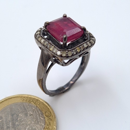 50 - A stunning ruby, diamond and gem stone ring, set with .36 carats of diamonds and set in sterling sil... 