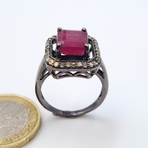 50 - A stunning ruby, diamond and gem stone ring, set with .36 carats of diamonds and set in sterling sil... 