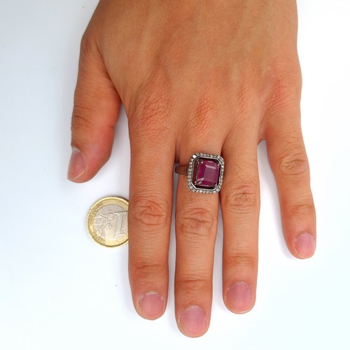 50 - A stunning ruby, diamond and gem stone ring, set with .36 carats of diamonds and set in sterling sil... 