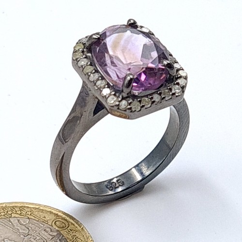 52 - A fabulous example of a Ametrine and Diamond ring, set nicely with a halo of .42 carats of Diamonds.... 