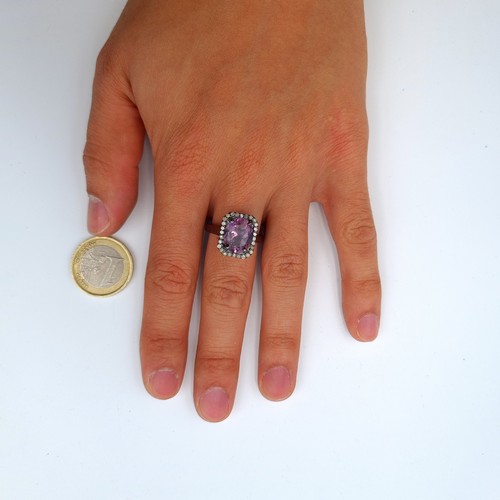 52 - A fabulous example of a Ametrine and Diamond ring, set nicely with a halo of .42 carats of Diamonds.... 