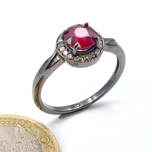 55 - Star Lot : A pretty certified natural Ruby ring, set with sparkling Diamond accents. The central sto... 