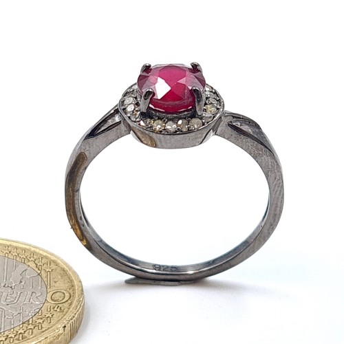 55 - Star Lot : A pretty certified natural Ruby ring, set with sparkling Diamond accents. The central sto... 