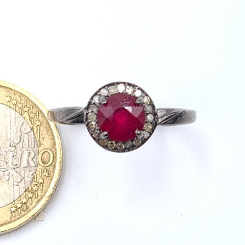 55 - Star Lot : A pretty certified natural Ruby ring, set with sparkling Diamond accents. The central sto... 