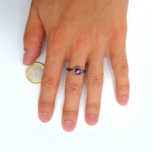 55 - Star Lot : A pretty certified natural Ruby ring, set with sparkling Diamond accents. The central sto... 