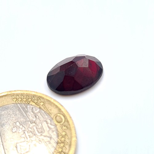 838 - Two certified Garnet stones, comprising of a Alamndite example of a large 10.9 carats. Together with... 