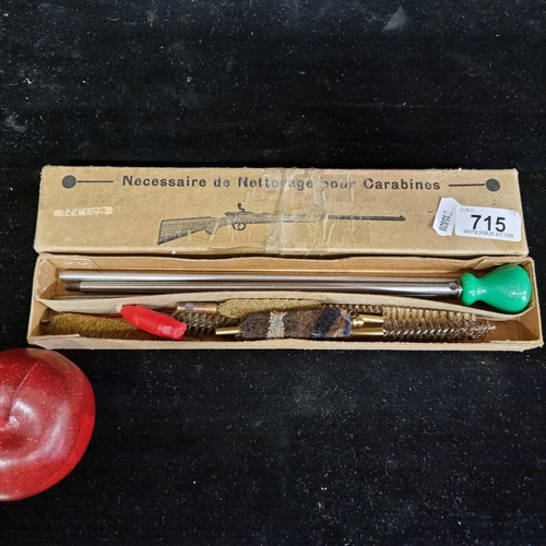 715 - A vintage French gun cleaning kit in original box. Containing a rod and screw-on brushes.