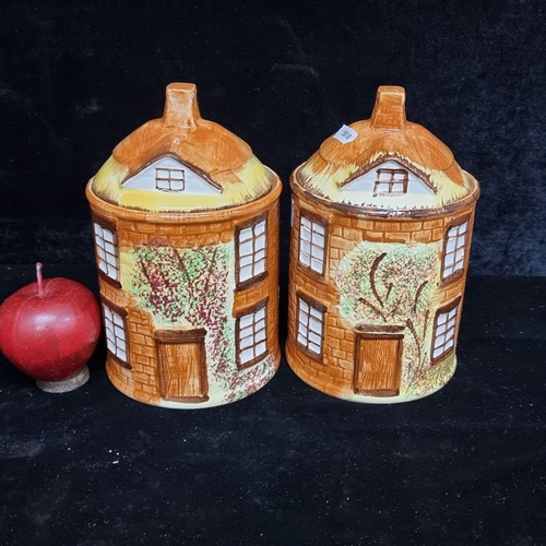 Two ceramic lidded cookie jars made by Price Kensington in the cottage ware pattern. In good condition.