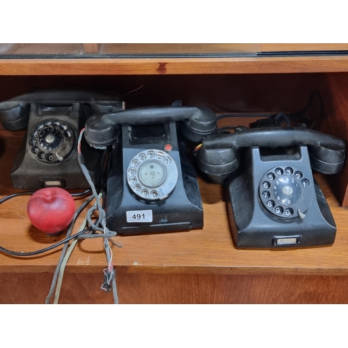 491 - Three vintage rotary dial telephones, two made by Ericsson LM.