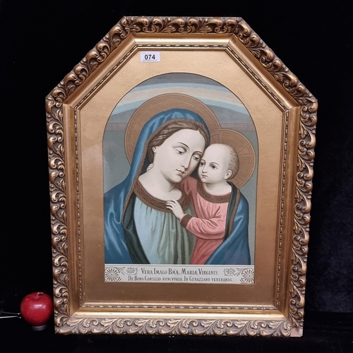 74 - A large antique chromolithograph of the Madonna and Child with Latin text to base. Housed in a heavy... 