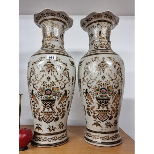 86 - A pair of large Chinese ceramic vases. An attractive pair with crazed finish and moriage pattern of ... 