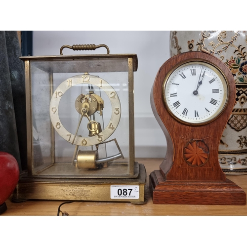 87 - Two vintage mantle clocks including an Edwardian example in red mahogany case with  partial marquetr... 