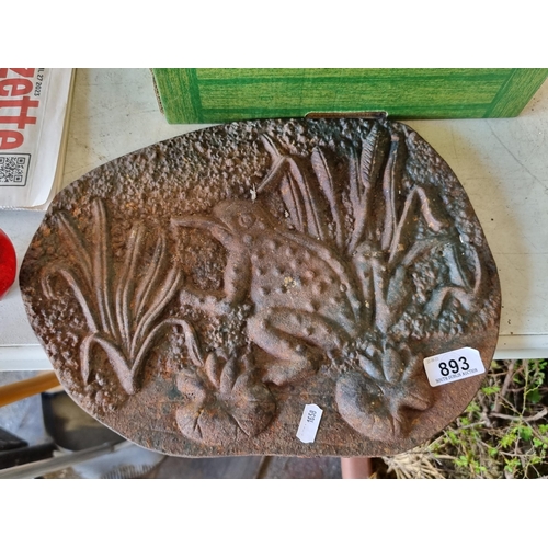 893 - A heavy cast metal plaque with a relief motif of a frog perched on a lily pad. W35cm