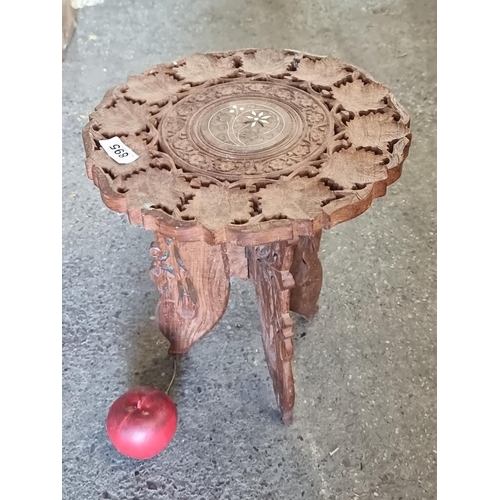 895 - A beautiful carved Indian rosewood plant stand. A two part piece with pierced foliate motifs and bra... 