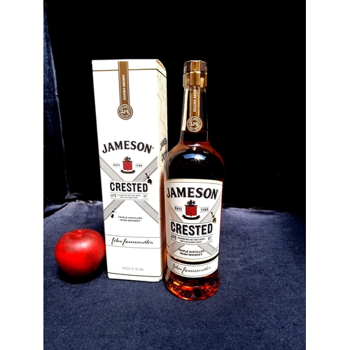 945 - A sealed 70c bottle of Jameson Crested triple distilled Irish Whiskey in presentation case.