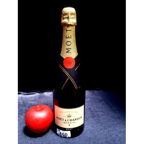 960 - A sealed 75cl bottle of Moet & Chandon Imperial Champagne brut.