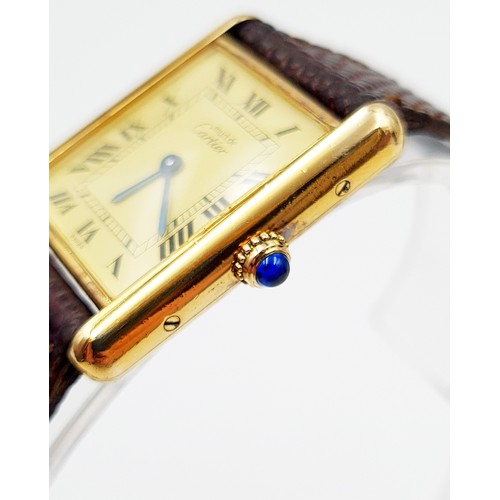 13 - Star Lot : An excitingly iconic Must de Cartier original vintage tank watch, this exceptional design... 