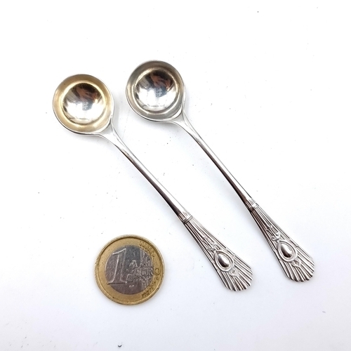 20 - Two sterling silver condiment spoons, set with attractive shell motif finials. Hallmarked Sheffield,... 