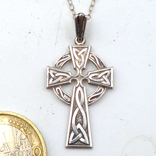 24 - A sterling silver Celtic Irish tall cross pendant necklace, set with a sterling silver chain. Length... 