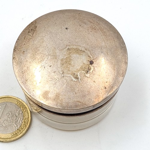 28 - A sterling silver topped rouge jar, set with screw top and gilt interior. Marks present but indistin... 