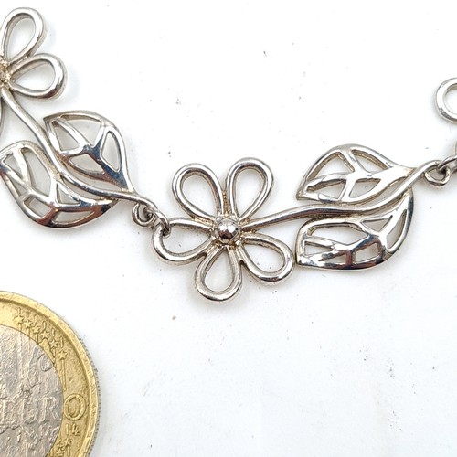 40 - A very attractive sterling silver floral link designed choker style necklace, set with a lobster cla... 