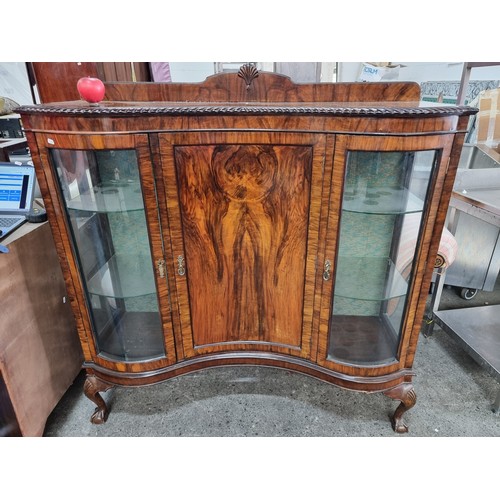 936 - Star Lot - A beautiful antique flamed mahogany display case. A serpentine fronted Victorian example ... 