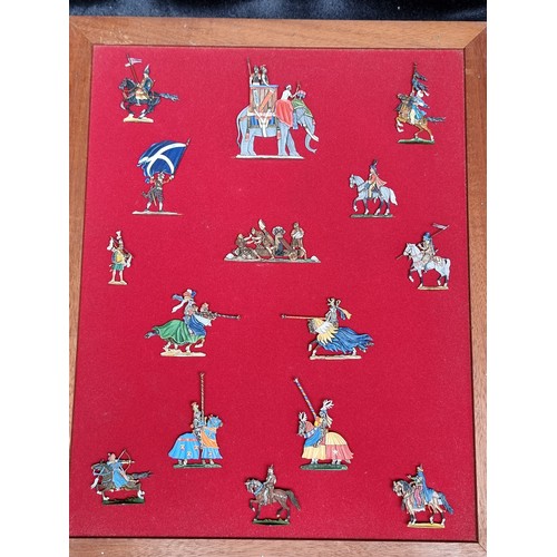 106 - A glazed display box of handpainted German flat figures of a military theme. Beautifully painted wit... 