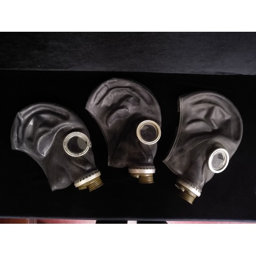 902 - Three vintage Soviet Russian rubber military gas masks. All complete with eye lenses.