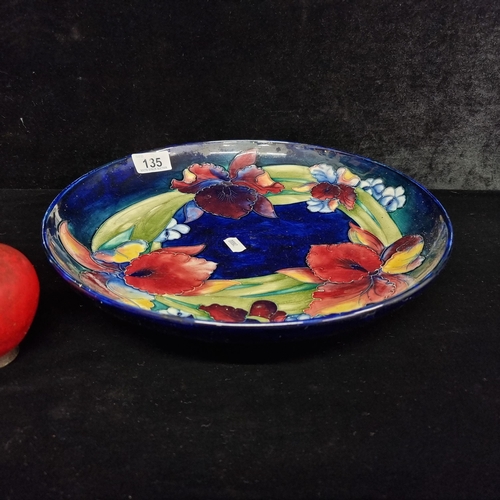 135 - Star Lot - A stunning  large original vintage Moorcroft display charger plate. Designed in the elega... 