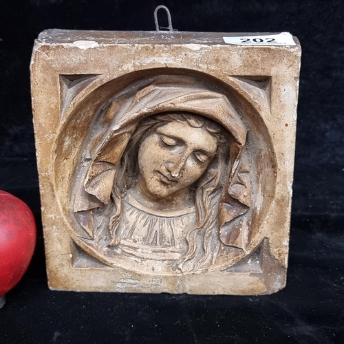 202 - A beautiful vintage ceramic wall plaque featuring a portrait of The Virgin Mary with demure downcast... 