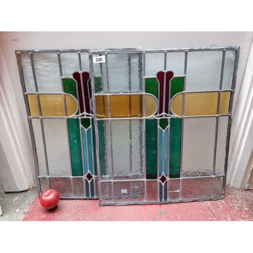 226 - A beautiful pair of vintage Art Deco style stained glass panels boasting attractive Flemish glass pi... 