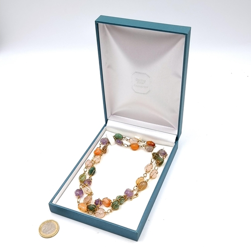 554 - A multi coloured natural Agate stone vintage necklace, set with twist chain detailing. Length: 72cm.... 