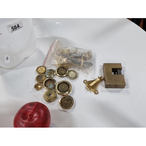 584 - A mix lot of vintage brass hardware including a number of brass weights and furniture table locks an... 