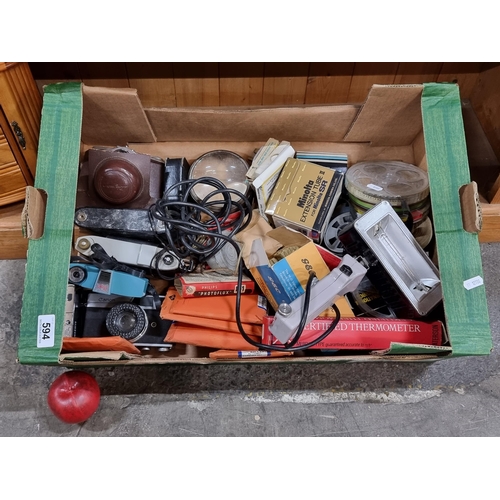 594 - A large mixed lot of vintage photographic and camera equipment. Including a Canonet film camera, a M... 