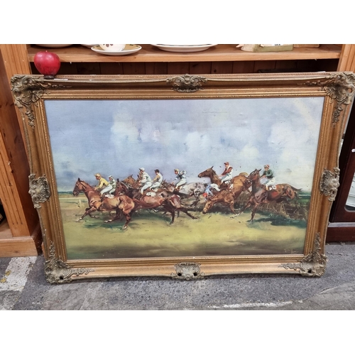 599 - A lovely vintage frame with foliate cresting housing an equestrian themed oleograph. H76cm x W105cm