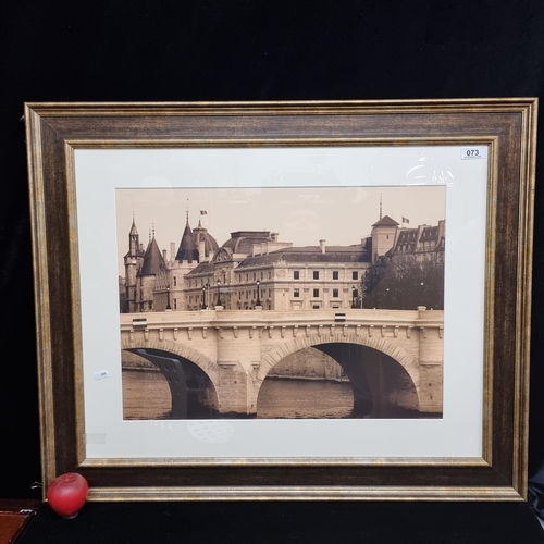 73 - A large print of a photograph showing the historical Parisian landmark, Le Pont Neuf, in sepia tones... 