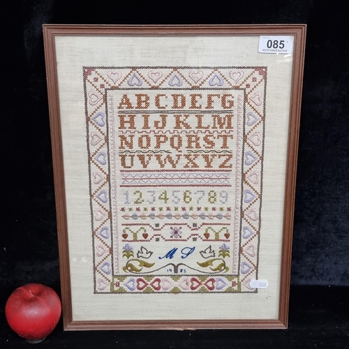 85 - A delightful retro cross stitch sampler showing all the letters of the alphabet, numbers 1-9 along w... 