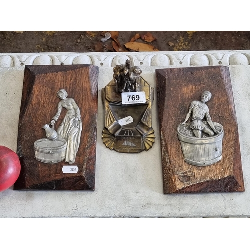 769 - Three French items including two wooden plaque wall hangings with cast pewter figurative reliefs and... 