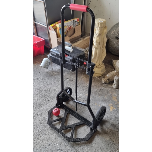 775 - A very handy foldaway hand truck trolley with two rubber castors and extendable handle to top.