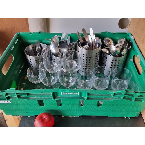 780 - A mixed lot including stemmed wine glasses, stainless steel cutlery, utensil holders and a quantity ... 