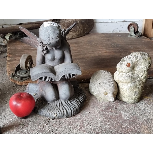 791 - Three reconstituted stone garden sculptures including a squirrel, hedgehog and a fairy reading a boo... 