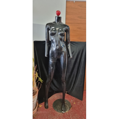 799 - A full size  commercial female mannequin with moveable arms, torso and right leg. Fixed on a chrome ... 