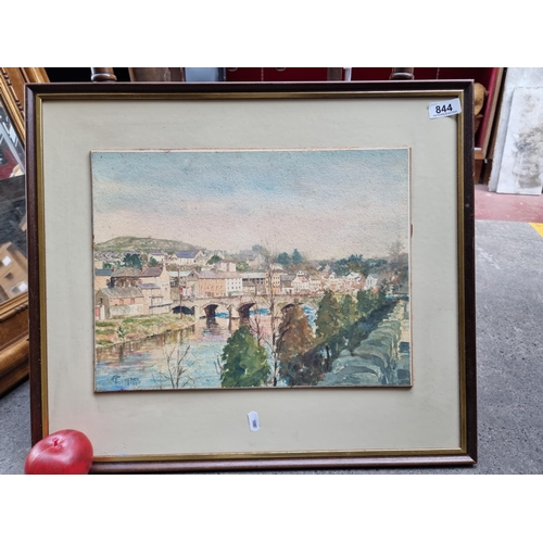 844 - A lovely original watercolour on paper painting featuring a view of a riverside town with stone brid... 