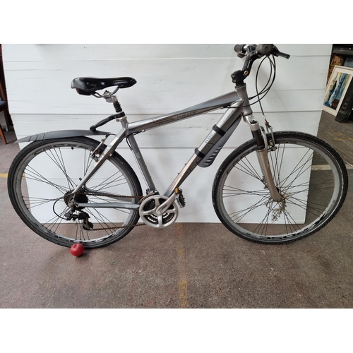 857 - Star Lot : A Cross Razor bicycle with an alloy frame and Shimano gears. In a silver finish. With int... 