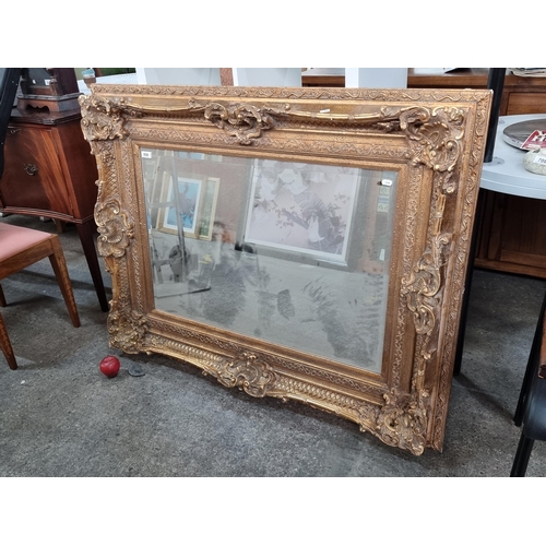 858 - Star Lot - A magnificent very large  rectangle heavy Baroque style over mantle mirror. Sporting beve... 