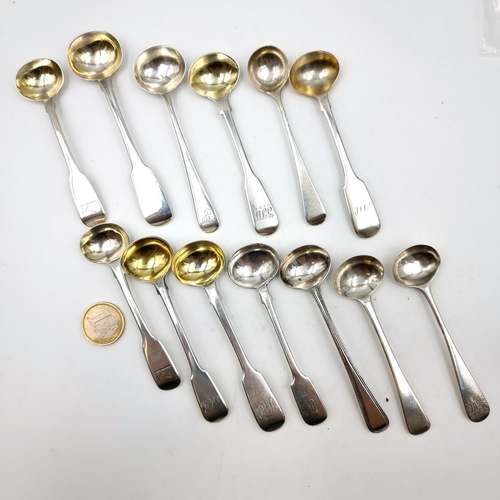 888 - Star lot :An excellent and large collection of 13 sterling silver cruet spoons, set with fiddle fina... 